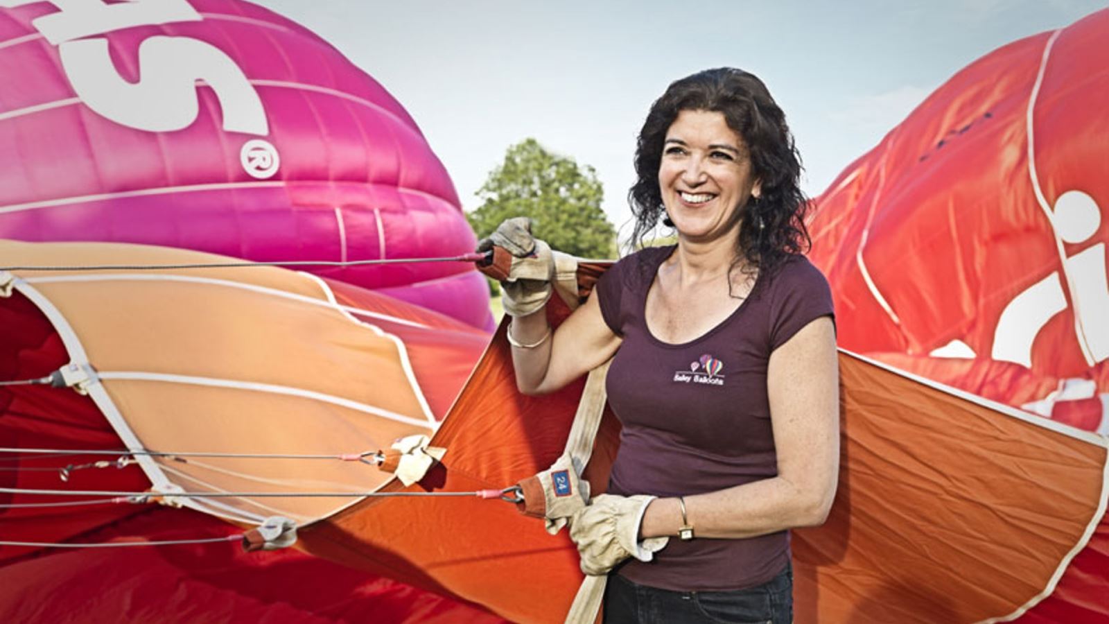 Jo Bailey of Bailey Balloons holding hot air balloon